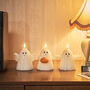 Set Of Three Halloween Ghost Tru Glow Pillar Candles, thumbnail 1 of 4