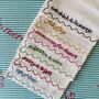 Set Of Six Embroidered Festive Phrase Napkins, thumbnail 1 of 12