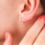 18ct Gold Star Huggie Earrings, thumbnail 1 of 7