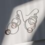Silver And Rose Gold Swinging Circles Dangly Earrings, thumbnail 3 of 10