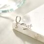 Sterling Silver Tiny Four Point Star Huggie Hoop Earrings, thumbnail 2 of 11