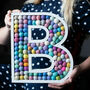 Personalised Initial Felt Ball Wooden Painted Letter, thumbnail 1 of 12