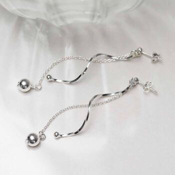 Sterling Silver Dancing Twist And Ball Stud Earrings, 2 of 5