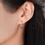 Sapphire Blue Flower Cz Huggie Hoop In Sterling Silver, thumbnail 1 of 12