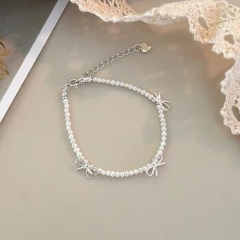 Saskia Ivory Silver Pearl Ribbon Ball Charm Gift Bracelet, 2 of 6