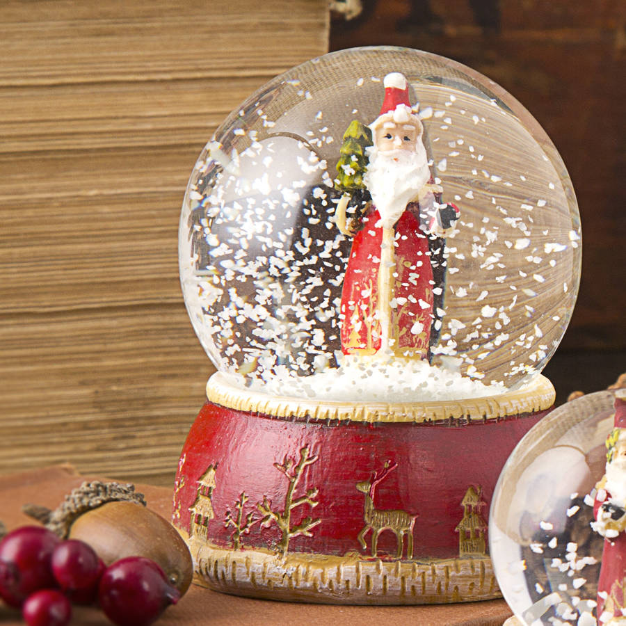 traditional santa snow globe by the christmas home | notonthehighstreet.com