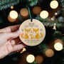 Baby's First Christmas Nordic Foxes Wooden Bauble, thumbnail 1 of 3