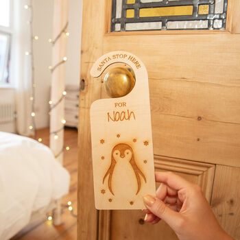 'Santa Stop Here' Personalised Penguin Door Hanger, 2 of 6
