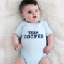 'Team Surname' Personalised Baby Grow, thumbnail 2 of 5