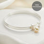Personalised Sterling First Pearl Christening Bangle, thumbnail 1 of 7