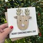 Mum And Dad Hanging Reindeer Decoration Christmas Card, thumbnail 1 of 3