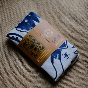 Traditional Tattoo Navy Blue Screen Printed Tea Towel, 5 of 7