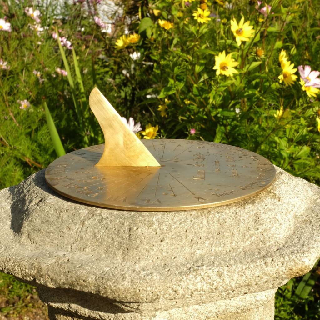Clean a brass sundial with polishing cloths from