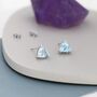 Genuine Swiss Blue Topaz Trillion Cut Stud Earrings, thumbnail 1 of 8