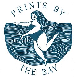 Blue and white linocut logo that says Prints by the Bay and a woman with flowers in her hair
