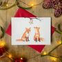 Woodland Christmas: Foxes And Mistletoe Christmas Card, thumbnail 1 of 9