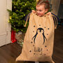 Personalised Christmas Penguin Hessian Sack, thumbnail 1 of 4