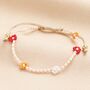 Pull Cord Red And Orange Daisy Beaded Bracelet, thumbnail 1 of 2