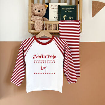 Personalised North Pole Christmas Rompersuit Or Pyjamas, 2 of 5