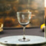 A Set Of Four Smoky Wine Glasses With Lens Design, thumbnail 1 of 2