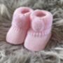 Pink Knitted Baby Booties With Pom Pom, thumbnail 4 of 8