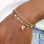 Semi Precious Beaded Blue Turtle Charm Bracelet In Gold Plating, thumbnail 1 of 5