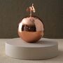 Copper Hammered Brass Sphere With Ginkgo Leaf Handle, thumbnail 1 of 2