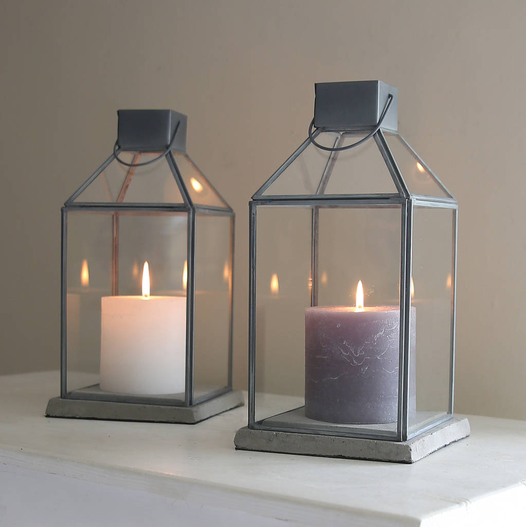 grey framed glass lantern by red lilly