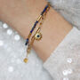 Lapis Lazuli And Gold Sunburst Charm Bracelet, thumbnail 1 of 8
