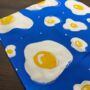 Fried Egg Pattern Full Colour Blue And Yellow Tea Towel, thumbnail 3 of 3