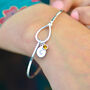 Personalised Sterling Silver Knot Birthstone Bangle, thumbnail 1 of 8