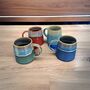 Set Of Four Reactive Glaze Mugs In Seashore Glazes, thumbnail 5 of 5