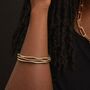 Set Of Three Gold Plated Wave Edge Bangle Bracelet Stack, thumbnail 1 of 5