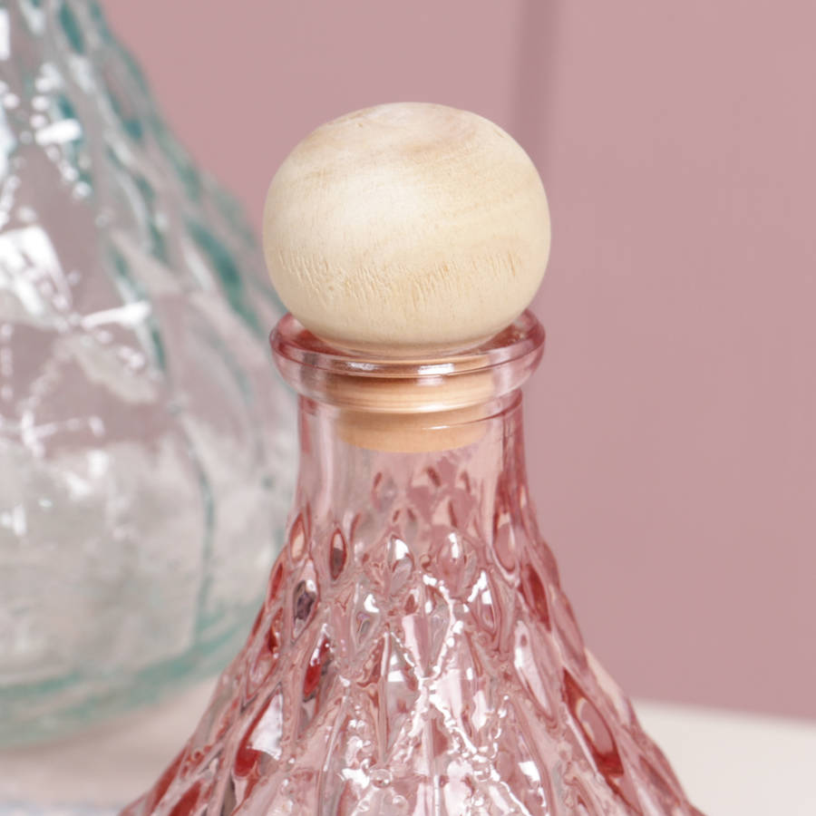 trio of decorative glass bottles with stoppers by dibor