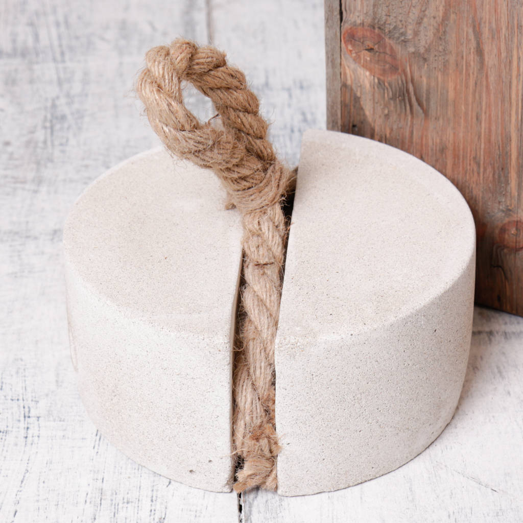 concrete circular door stop with rope loop handle by dibor