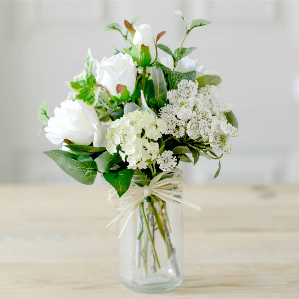 faux white rose english garden blooms with vintage jar by the flower