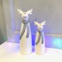 Pair Of Christmas Ceramic Reindeer With Scarf, thumbnail 1 of 5
