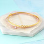 Opal Triple Stone Rose/Gold Plated Birthstone Bangle, thumbnail 1 of 3