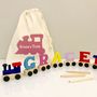 Personalised Coloured Wooden Name Train And Gift Bag, thumbnail 3 of 8
