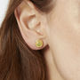 Gold And Peridot Swirl Earrings, thumbnail 1 of 3