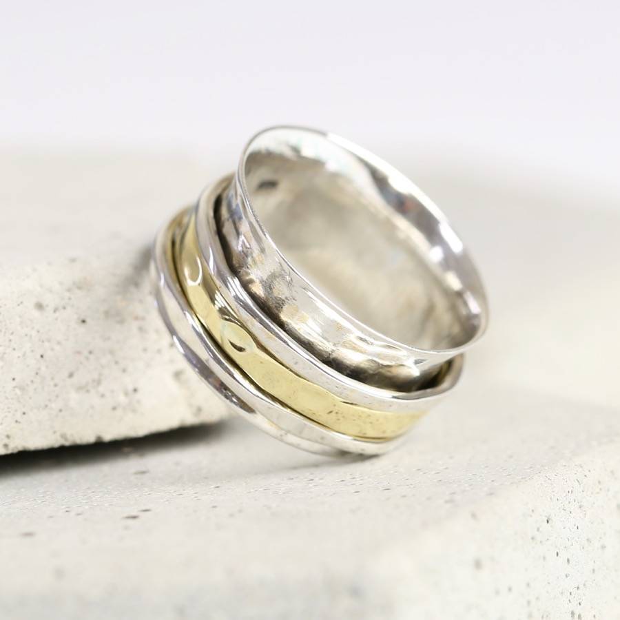 sterling silver  and gold  hammered effect spinning ring  by 