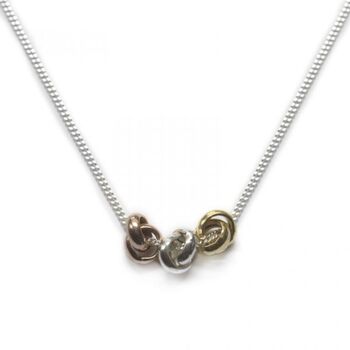 Three Knot Necklace In Silver, Rose And Gold, 3 of 6
