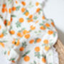 Orange Clementine Organic Bamboo Tassel Baby Blanket, thumbnail 3 of 3