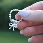 Sterling Silver Ball Bead Ring With Bow Charm, thumbnail 1 of 7