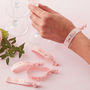 Pink And Rose Gold Team Bride Hen Party Wrist Bands, thumbnail 1 of 3