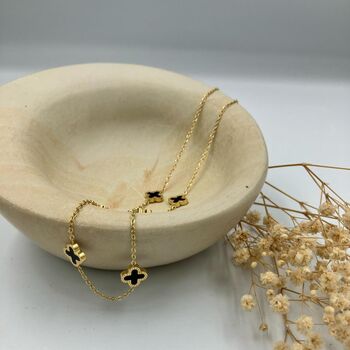 Six Small Clover Necklace In Black And Gold, 2 of 4