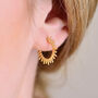 Gold Sunburst Huggie Hoop Earrings, thumbnail 1 of 6