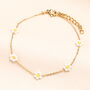 Stainless Steel White Beaded Daisy Charm Bracelet In Gold Plating, thumbnail 1 of 2