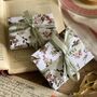 Gold Folksy Floral Huggie Earrings, thumbnail 7 of 8