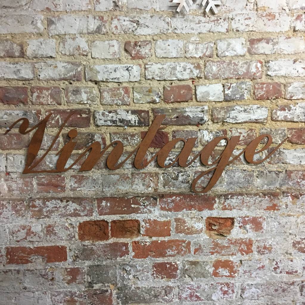 rusted vintage word sign by bobo's beard company